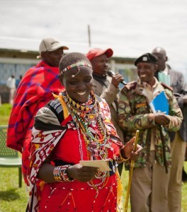 A Maasai woman reads the new katiba after the announcement.