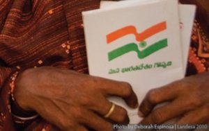 Woman from Andhra Pradesh holding her land title