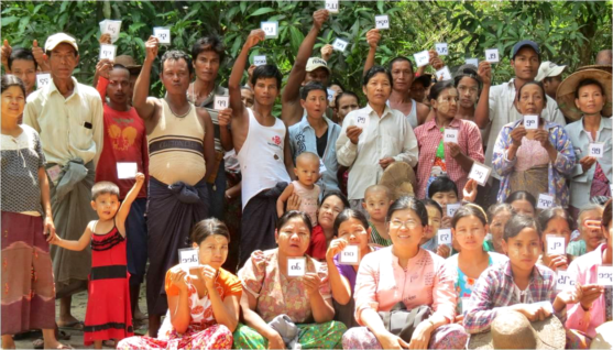 In Ta Myar village, pictured here, nearly all families were landless laborers. These 140 new smallholders hold lottery cards naming which 1 acre plot they received.